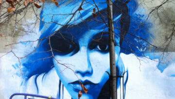 beautiful spray paint art of woman's face in blue